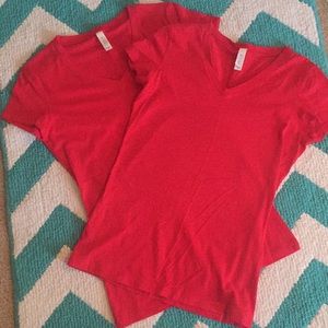 Two of the same red tee-shirts $2 EACH  $5 BOTH